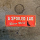 A spoiled Lab Lives Here -  Metal Wall Sign