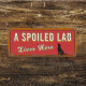 A spoiled Lab Lives Here -  Metal Wall Sign